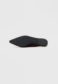 Black suede high-heeled shoe sole with a pointed toe. Features textured black rubber grip and slight arch at the heel. Brand name visible.