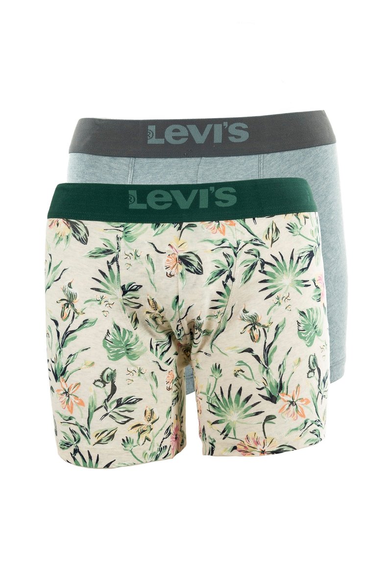 Trois paires de boxers Levi's : une avec une ceinture grise, une en bleu clair uni et une avec un imprimé floral sur tissu crème.