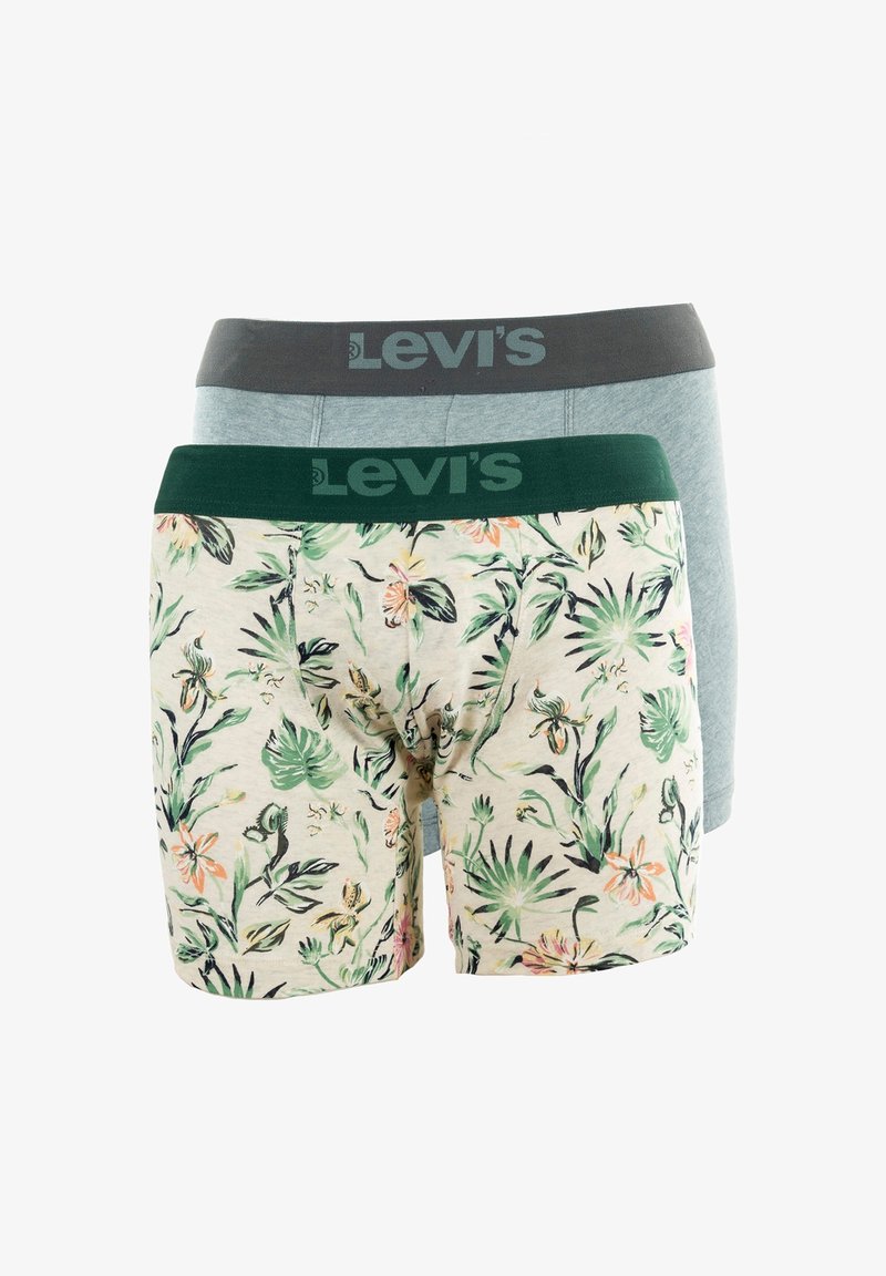 Trois paires de boxers Levi's : une avec une ceinture grise, une en bleu clair uni et une avec un imprimé floral sur tissu crème.