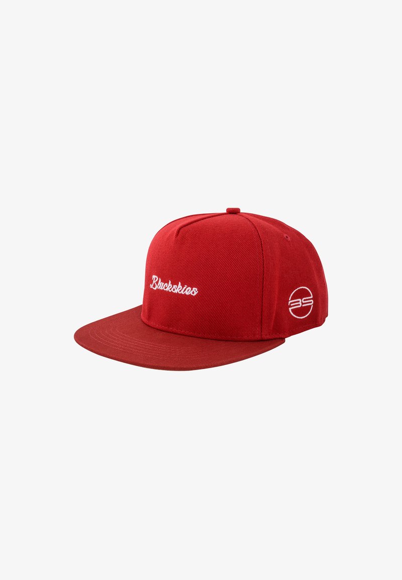 Red snapback cap made of textured fabric. Features white embroidered text and logo. Flat visor with stitching details, side ventilation holes.