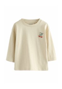 Beige Langarmshirt aus weicher Baumwolle. Mit einem gedruckten Elefanten auf einem Skateboard. Rundhalsausschnitt und entspannte Passform.