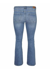 Flared blue denim jeans with a smooth texture, featuring two back pockets and a brown leather logo patch on the waistband.
