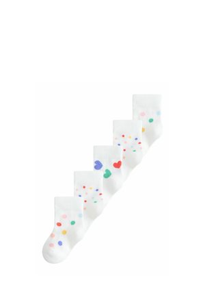 Six pairs of white socks arranged diagonally, each with colorful polka dots or heart patterns in various colors.