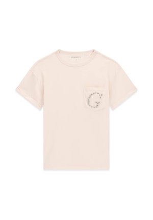 T-shirt beige clair à manches courtes et col rond avec une poche avant ornée d’un « G » décoratif serti de bijoux sur la poitrine gauche.