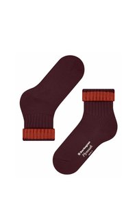 Chaussettes bourgogne avec des manchons côtelés orange. Fabriquées dans un matériau doux, elles présentent une texture lisse et des accents de couleur contrastés.