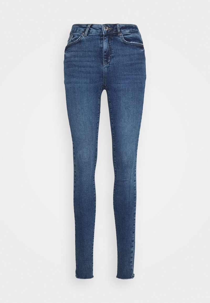 Jeans skinny em denim azul escuro, com uma cintura alta, design clássico de cinco bolsos e desbotamento subtil nas coxas e joelhos.