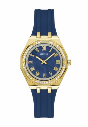 Orologio ottagonale dorato con quadrante blu, numeri romani e dettagli in cristallo, dotato di un cinturino in silicone blu.