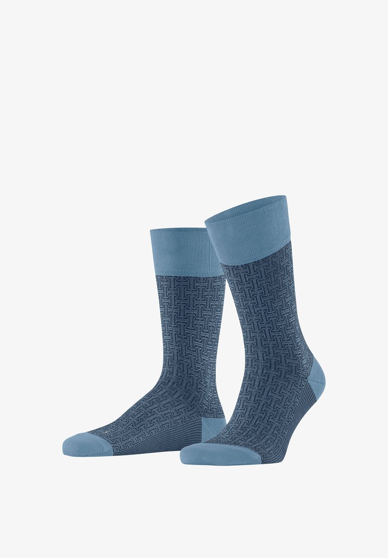 Pair of blue crew socks with light blue cuffs, heels, and toes, featuring a textured geometric pattern on the main body.
