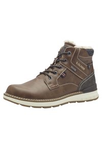 Bottine en cuir marron avec une semelle en caoutchouc blanche, col doublé en fourrure, accents gris contrastants et détail du logo sur le côté.