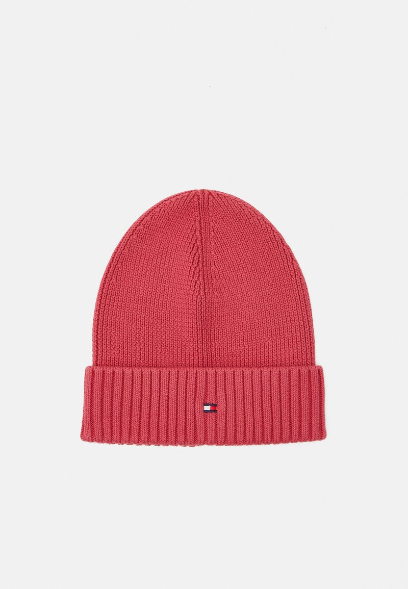 Πλεκτό σκουφάκι σε φωτεινό ροζ χρώμα με ριχτό μανσέτα. Διαθέτει μια μικρή ετικέτα με λογότυπο κοντά στο κάτω μέρος. Μαλακή υφή, στρογγυλή κορυφή.