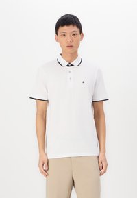White polo shirt with black collar and sleeve trim, featuring two buttons and a small logo on the left side. Made of smooth, lightweight fabric.