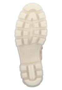 Suela de zapato con goma blanca texturizada, con relieves y un corte ovalado central. Logo estampado en el centro de la suela.
