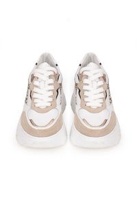 Sport sneakers featuring a white synthetic upper with beige suede accents, mesh details, and flat white laces. Thick white rubber sole.