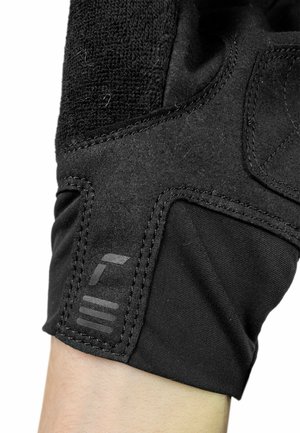 Black glove featuring a blend of textured fabric and smooth material. Notable details include padded sections and a brand logo on the cuff.