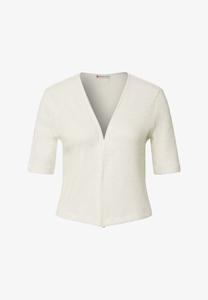 Krátký rukáv, top s véčkovým výstřihem z texturované bílé látky, s přiléhavým střihem a jemnými švy podél přední části a lemu.