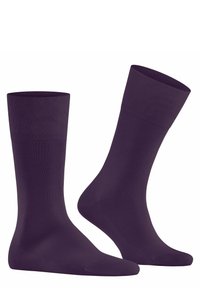Calzini crew a lunghezza media di colore viola, realizzati in tessuto liscio con polsini a coste, presentano un colore uniforme e un design senza cuciture nella punta.
