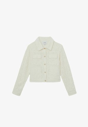 Kreemjat tekstuuriga nööpidega jakk krae, kahe rinna tasku, pikkade varrukatega ja kuldse tooniga nööpidega ees.