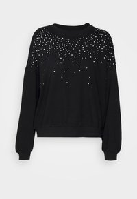 Sudadera negra con un corte relajado, mangas largas, puños acanalados y un diseño adornado con tachuelas plateadas dispersas en el frente.