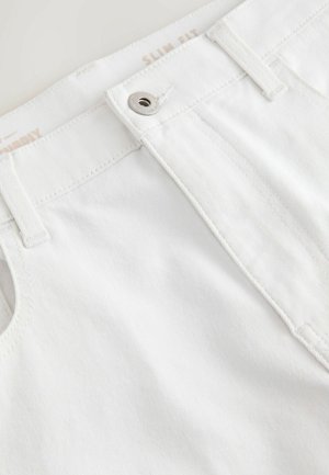 Slim fit white denim pants with a smooth texture. Features a metal button closure, and topstitching detail along the waistband and pockets.