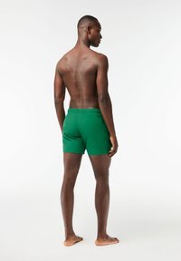 Lacoste Plaukimo šortai - rocket/green