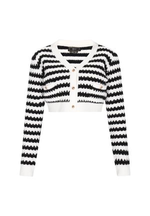 Fekete-fehér csíkos rövidített kardigán, puha kötött anyagból készült, V-kivágású, hosszú ujjak vannak rajta, és négy elülső gomb díszített zsebekkel.