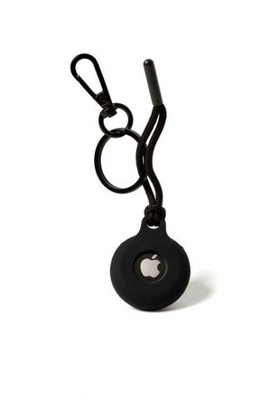 Black silicone Apple AirTag holder with a round shape, attached to a black carabiner and braided cord, featuring a visible Apple logo.