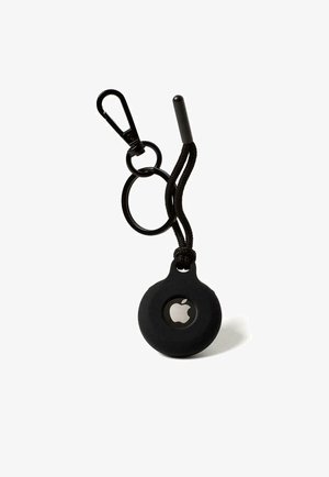Black silicone Apple AirTag holder with a round shape, attached to a black carabiner and braided cord, featuring a visible Apple logo.