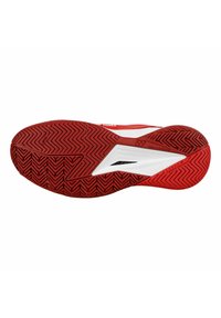 Suola di scarpa da ginnastica rossa con un motivo a zigzag, una sezione accentuata bianca e materiale in gomma testurizzato per aderenza e durata.