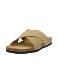 Beige suede cross-strap sandal with a cork footbed, textured brown sole, and open design for breathability.