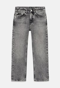 Grå denimbyxor med rak passform, femfickorsdesign och knäppning. Har urvuxna och slitna mönster överallt.