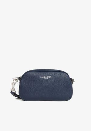 Navy blue pebbled leather crossbody bag with silver hardware and "LANCASTER PARIS" logo on the front.