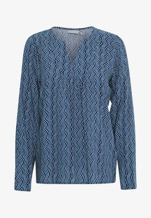 Blouse à motif bleu avec des manches longues, dotée d'un col en V et d'un tissu fluide, affichant un design ondulé dans des tons de bleu foncé et clair.