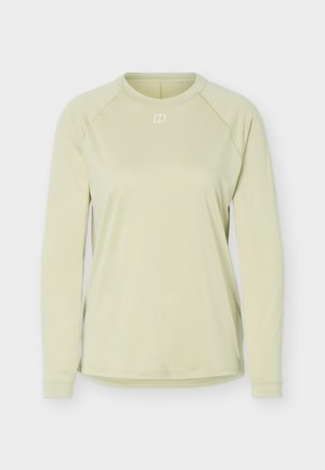 Haut de sport vert clair à manches longues avec col rond et petit logo blanc centré sous l’encolure sur un fond uni.