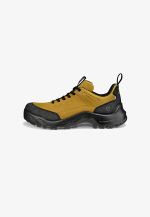 Wasserdichte Wanderschuhe mit einem gelben Wildleder-Obermaterial und einer schwarzen Gummikappe sowie einer Gummisohle. Verfügt über ein robustes Schnürdesign und eine Schlaufe.