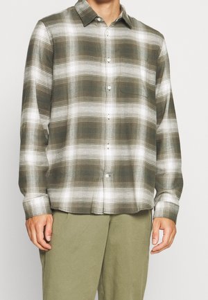 Green and white plaid button-up shirt made of soft fabric, featuring a collar, long sleeves, and a single chest pocket.