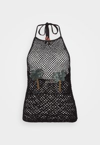 Top halter negro de red con adornos de hojas de lentejuelas verdes y cuentas en el escote, con una textura de tejido abierto.