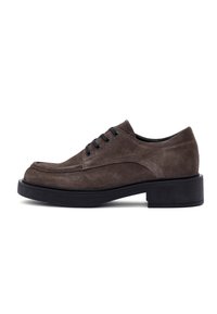 Brown suede lace-up shoe with a rounded toe, black eyelets, and a thick black sole. Smooth texture and minimalistic design.
