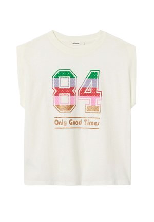 Le t-shirt crème à manches courtes arbore un graphique coloré « 84 » en points et un texte doré pailleté disant « Only Good Times ». Fabriqué en coton doux.