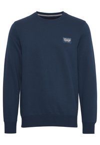 Donkerblauwe sweatshirt gemaakt van zachte stof, met een ronde halslijn, lange mouwen, geribbelde manchetten en een klein merklabel op de borst.