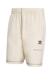 Kreminių šortų su elastinga juostele, kontrastingomis juodomis siūlėmis ir „Adidas“ logotipu kairėje šlaunyje. Yra dvi šoninės kišenės.