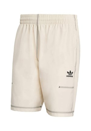 Cream shorts with an elastic waistband, contrasting black stitching, and an Adidas logo on the left thigh. Two side pockets are featured.