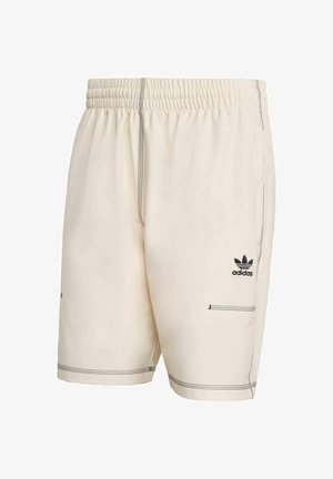 Cream shorts with an elastic waistband, contrasting black stitching, and an Adidas logo on the left thigh. Two side pockets are featured.