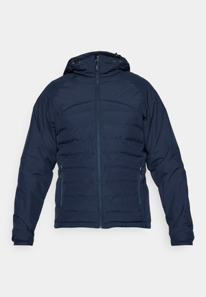 Giacca puffer blu navy con zip frontale, cappuccio regolabile e polsini elastici. Presenta un design elegante e una texture trapuntata per l'isolamento.