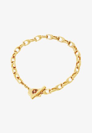 Bracelet chaîne en or avec des maillons ovales allongés et un fermoir à bascule, disposé en forme circulaire sur un fond blanc.