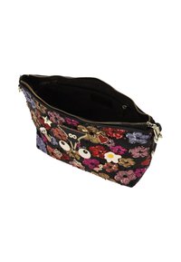 Fekete flitteres neszeszer, amely több színű virágmintákkal és dísztűkkel van díszítve. Cipzárral záródik, belül szövetbéléssel.