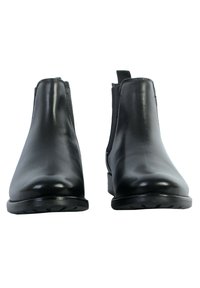 Stivaletti neri in pelle con una texture liscia, pannelli elastici laterali e tacco basso, caratterizzati da una punta arrotondata e dettagli di cucitura discreti.