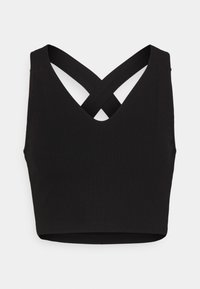 Top court noir côtelé avec larges bretelles qui se croisent dans le dos en formant un X, sans manches avec un décolleté en V devant.