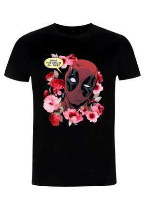 Black t-shirt featuring a graphic design of a character with a red mask surrounded by pink and red flowers and a speech bubble.