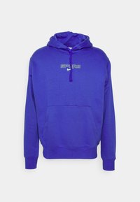 Felpa viola con tasca frontale, cappuccio con coulisse e logo "SPURS" bianco e verde sul petto. Tessuto morbido.