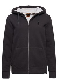 Sudadera con cremallera de color gris oscuro, con forro de felpa blanca, capucha ajustable con cordón y dos bolsillos frontales. Presenta puños y dobladillo de canalé.
